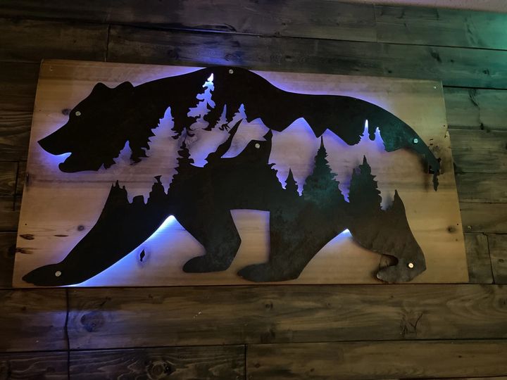 Grizzly Bear Mountain Scene on Cedar with back lighting