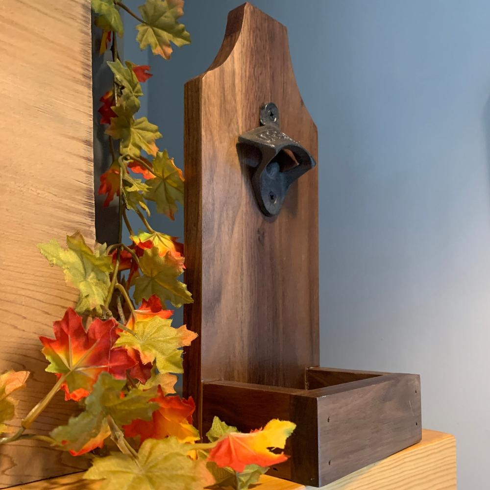 Bottle opener with catch